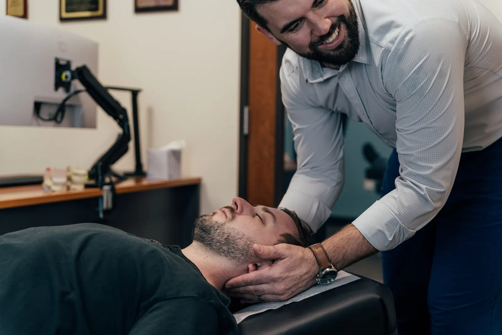 Dr. Brent Johnson adjusting a patient for neck pain in San Antonio