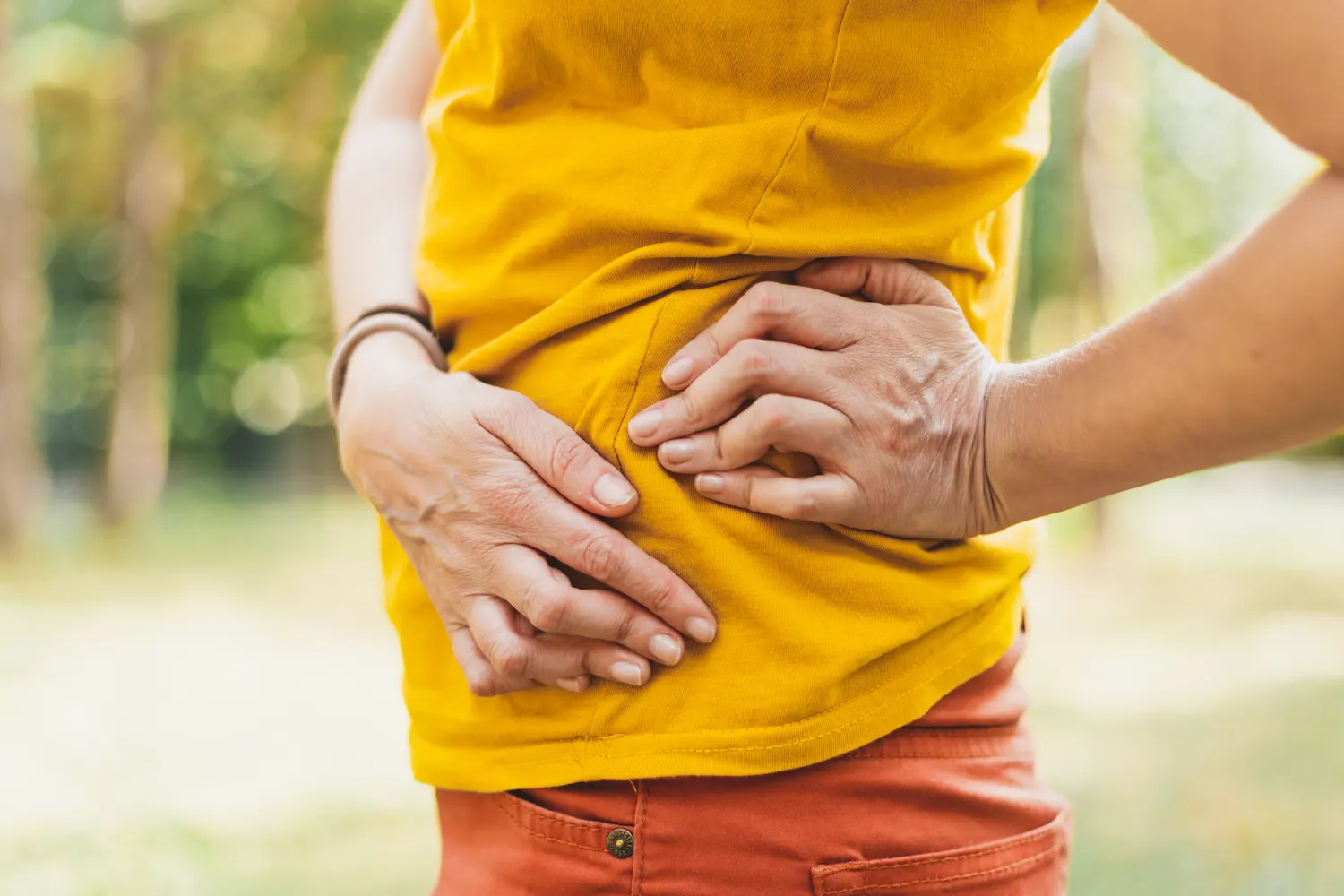 a man touching his hip pain
