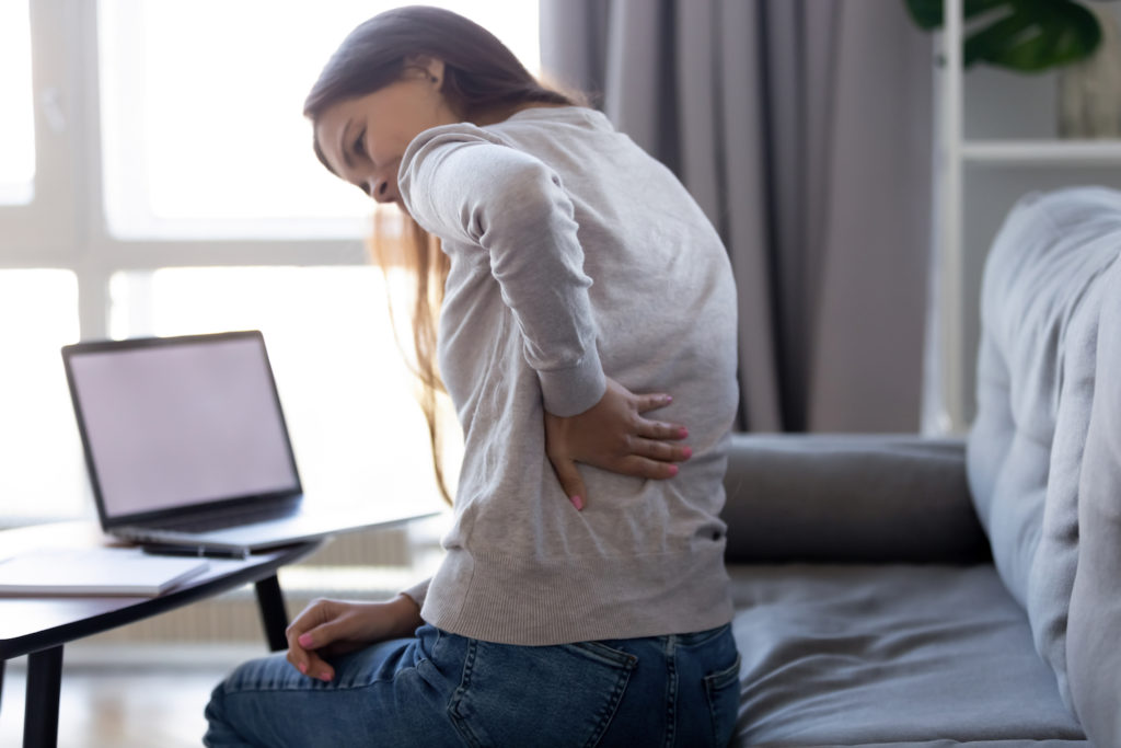 A woman suffering from back pain